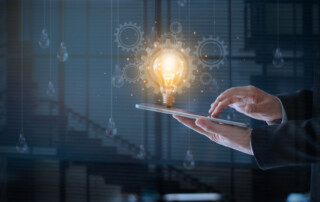 Abstract of Technology and innovation, creativity and inspiration, Businessman using tablet with light bulbs with one glowing and wheel gear float on screen .